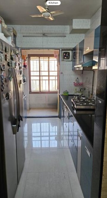 Kitchen in 2 BHK Apartment at Varun Garden, Ghodbunder Road – for Rent