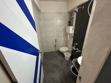 Bathroom in 2 BHK Apartment at Unique Poonam Estate Cluster 2, Mira Road – for Rent