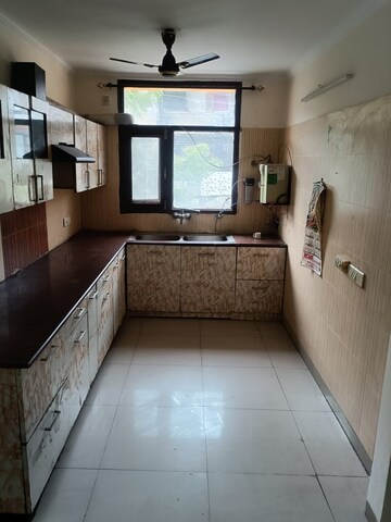 Kitchen in 3 BHK Apartment at Dhakoli Village – for Sale