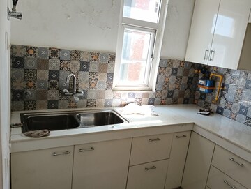 Kitchen in 3 BHK Apartment at Uninav Bliss, Raj Nagar Extension – for Rent