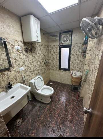 Bathroom in 2 BHK Apartment at Charms Castle, Raj Nagar Extension – for Rent
