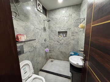 Bathroom in 3 BHK Apartment at Rajouri Garden – for Rent