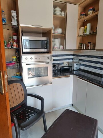 Kitchen in 2 BHK Apartment at Unitech Heritage City, Sector 25 – for Rent