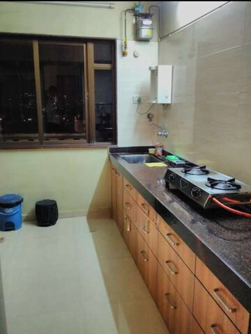 Kitchen in 2 BHK Apartment at Hyde Park Galaxy, Manpada – for Rent
