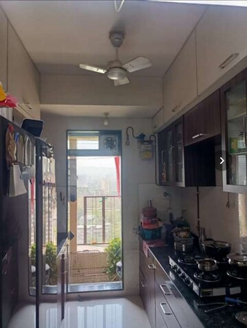 Kitchen in 2 BHK Apartment at Rustomjee Urbania, Majiwada – for Rent