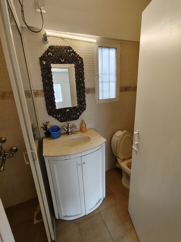 Bathroom in 2 BHK Apartment at Yogi Park CHS Koregaon, Koregaon – for Rent