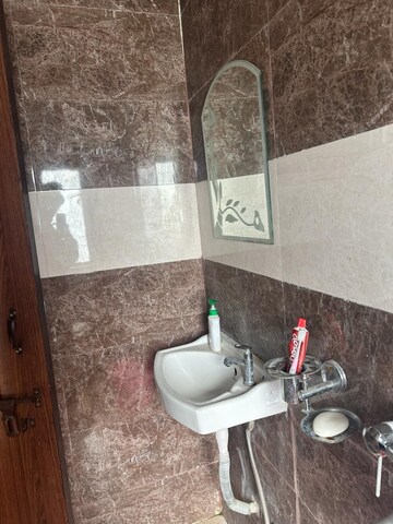 Bathroom in 1 RK Apartment at Emaar Emerald Floors Premier, Sector 65 – for Rent