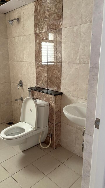 Bathroom in 3 BHK Apartment at Mantri Webcity, Hennur – for Rent
