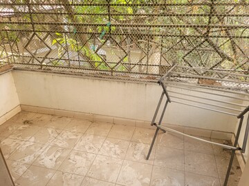 Balcony in 2 BHK Apartment at Kusum Kunj, Prabhat Road – for Rent