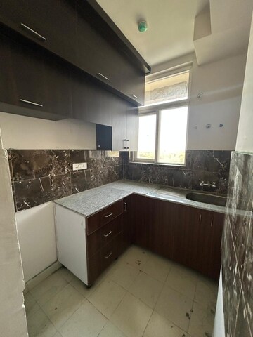Kitchen in 2.5 BHK Apartment at Amrapali Riverview, Amrapali Leisure Valley – for Rent