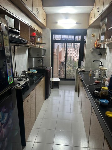 Kitchen in 2 BHK Apartment at Ani Anu Sri Balaji Enclave, Malad West – for Sale