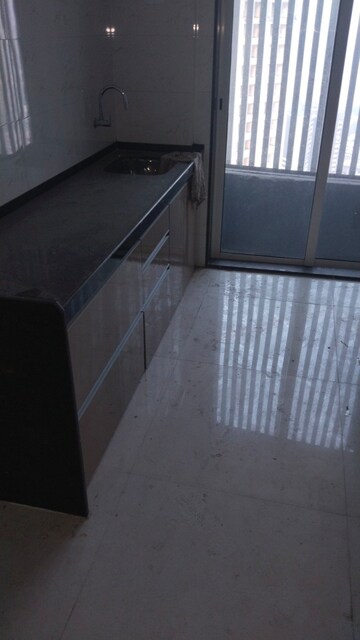 Kitchen in 2 BHK Apartment at Ani Anu Sri Balaji Enclave, Malad West – for Sale