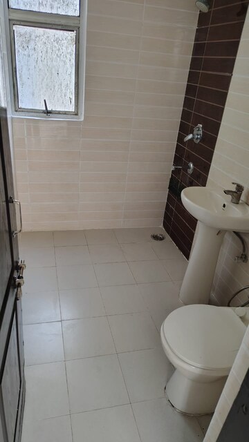 Bathroom in 3 BHK Apartment at Amrapali Zodiac, Sector 120 – for Sale