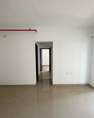 Living Room in 1 BHK Apartment at JP North Alexa, Hatkesh Udhog Nagar – for Sale