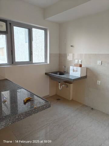 Kitchen in 1.5 BHK Apartment at Piramal Vaikunth, Balkum Pada – for Sale