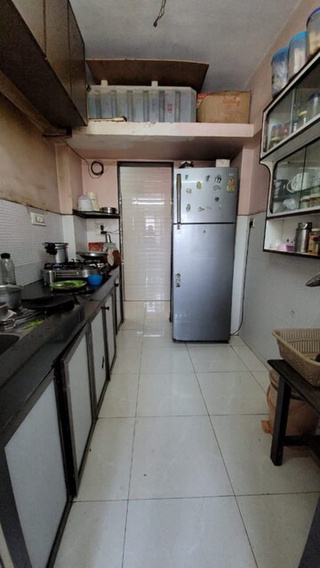Kitchen in 2 BHK Apartment at Evershine Pine CHS, Mira Road – for Sale