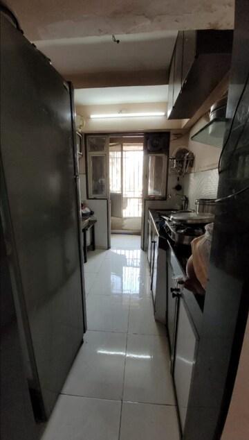 Kitchen in 2 BHK Apartment at Evershine Pine CHS, Mira Road – for Sale