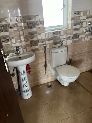 Bathroom in 3 BHK Apartment at Presithum, Sector 25 Yamuna Expressway – for Rent