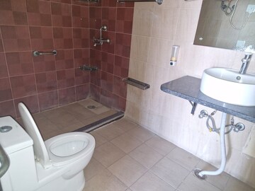 Bathroom in 4 BHK Apartment at Mahagun Mascot, Sain Vihar – for Sale