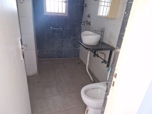 Bathroom in 4 BHK Apartment at Mahagun Mascot, Sain Vihar – for Sale