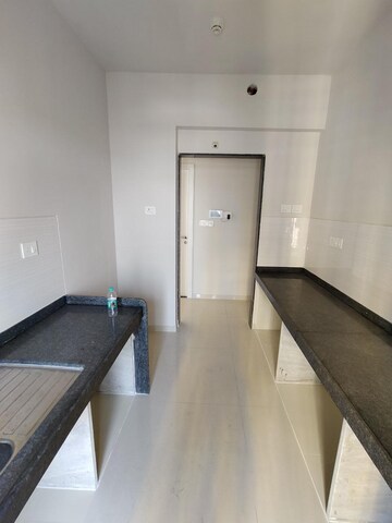 Kitchen in 2 BHK Apartment at Rustomjee Urbania Azziano, Majiwada – for Sale