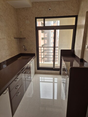 Kitchen in 2 BHK Apartment at Deiv Virat Grandeur, Thakurli – for Rent