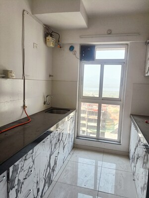 Kitchen in 1.5 BHK Apartment at Godrej Emerald, Ghodbunder Road – for Sale