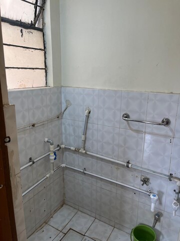 Bathroom in 1 BHK Apartment at Anuj Co-Op Housing Society, Wadgaon Sheri – for Rent