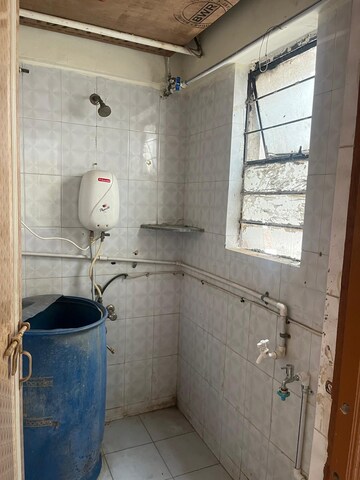 Bathroom in 1 BHK Apartment at Anuj Co-Op Housing Society, Wadgaon Sheri – for Rent