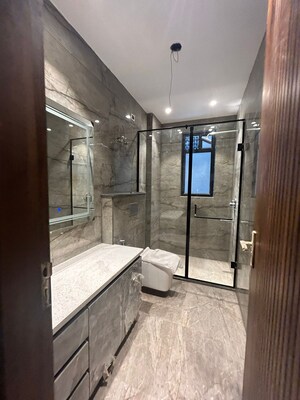 Bathroom in 4 BHK Builder Floor at Green Park Extension – for Sale