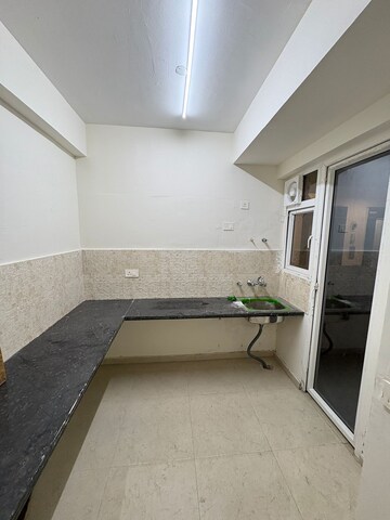 Kitchen in 2 BHK Apartment at Signature The Millennia 2, Sector 37d – for Rent