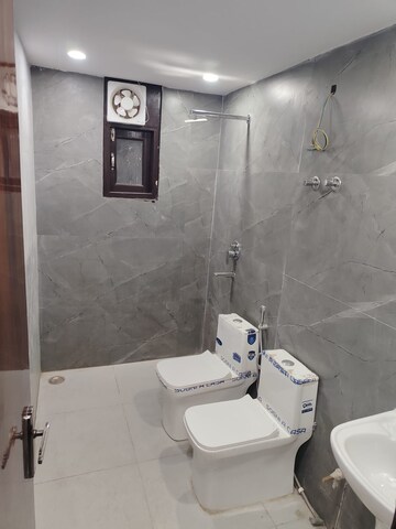 Bathroom in 4 BHK Apartment at Mahavir Enclave 1 – for Sale