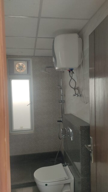Bathroom in 2.5 BHK Apartment at Aims Golf City, Sector 75 – for Rent