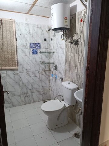 Bathroom in 3.5 BHK Apartment at Aims Golf City, Sector 75 – for Rent