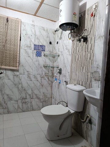 Bathroom in 3.5 BHK Apartment at Aims Golf City, Sector 75 – for Rent