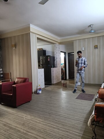 Living Room in 3.5 BHK Apartment at Aims Golf City, Sector 75 – for Rent