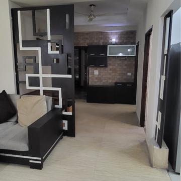 Living Room in 2 BHK Apartment at Mahagun Moderne, Sector 78 – for Rent