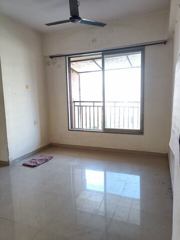 Living Room in 1 BHK Apartment at Kingston Tower, Vasai West – for Sale