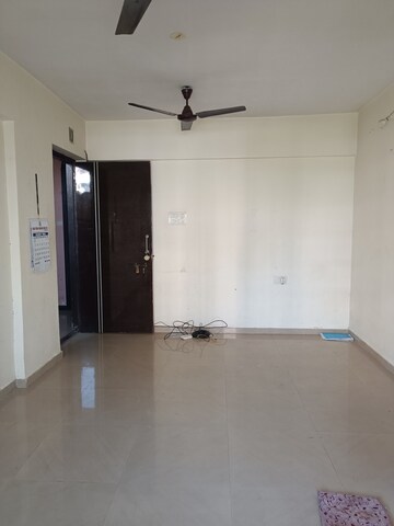 Living Room in 1 BHK Apartment at Kingston Tower, Vasai West – for Sale