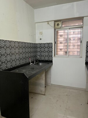 Kitchen in 1 BHK Apartment at Lodha Amara, Kolshet Road – for Sale