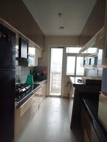 Kitchen in 3 BHK Apartment at Tulsiani Urban Woods, Sushant Golf City – for Rent