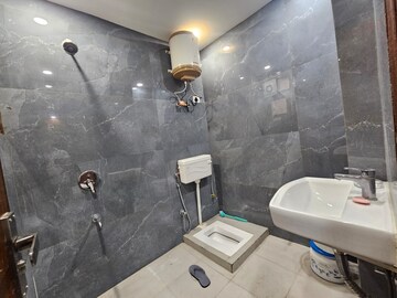 Bathroom in 3 BHK Builder Floor at Freedom Fighters Enclave – for Rent
