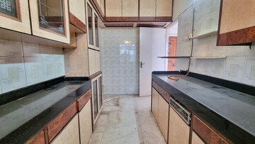Kitchen in 2 BHK Apartment at Vikas Park CHS, Malad West – for Sale