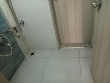 Bathroom in 2 BHK Apartment at Unique Poonam Estate Cluster 3, Mira Road – for Rent