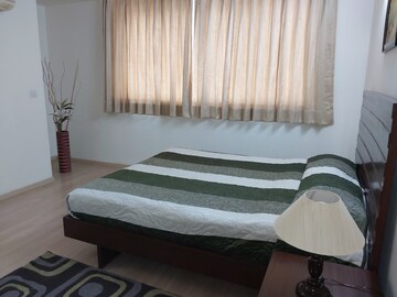 Bedroom in 4 BHK Apartment at DLF Park Place, Sector 54 – for Rent