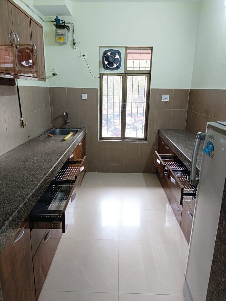 Kitchen, ajmera-beverly-hills-and-royal-empire 2 Bedroom 1000 Sq.Ft. Apartment In Andheri West Mumbai 8419069