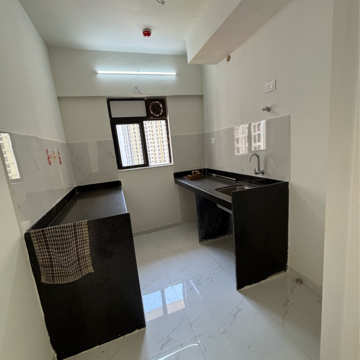 Kitchen in 1 BHK Apartment at Runwal Gardens, Dombivli East – for Rent
