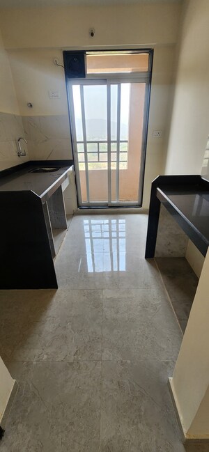 Kitchen in 1 BHK Apartment at Mahavir Kalpavruksha, Ghodbunder Road – for Sale