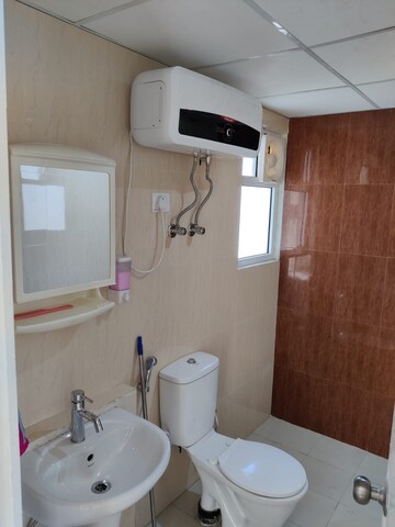 Bathroom in 2.5 BHK Apartment at Mahagun Mantra I, Sector 10 Greater Noida – for Rent