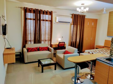 Living Room in 1 BHK Apartment at Supertech Czar Suites, Omicron I Greater Noida – for Rent